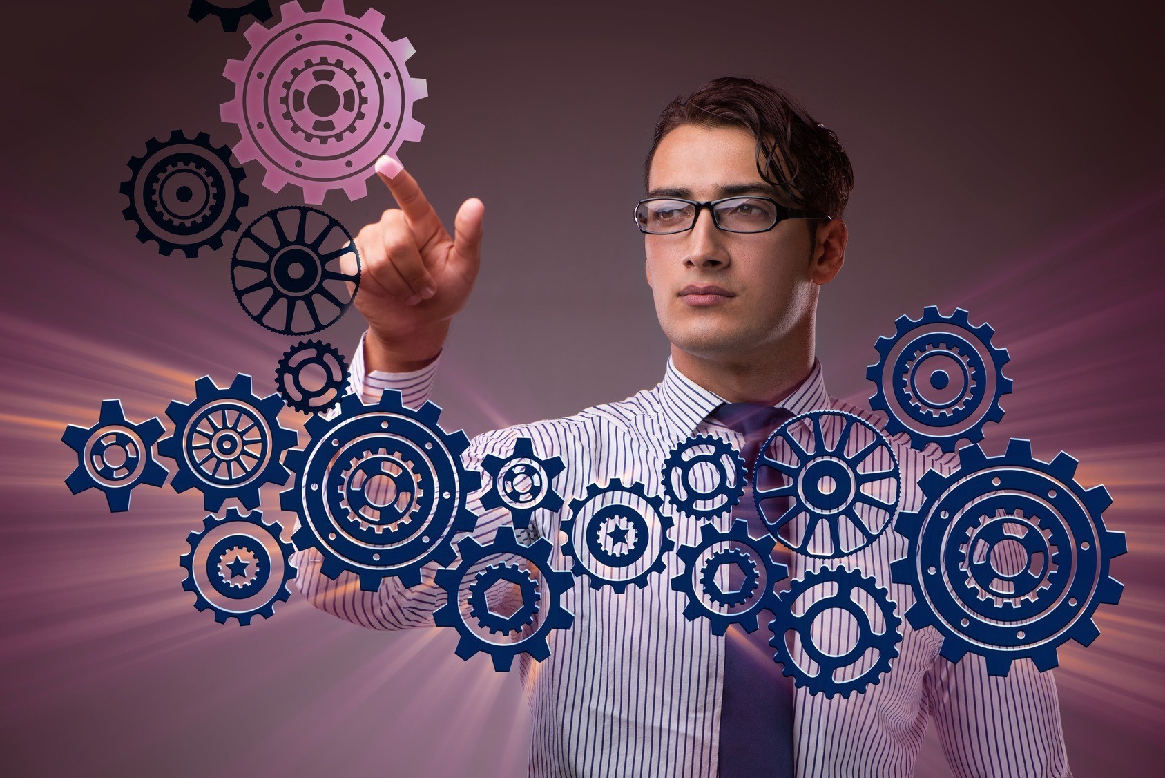 Businessman with cogwheels gear in teamwork concept